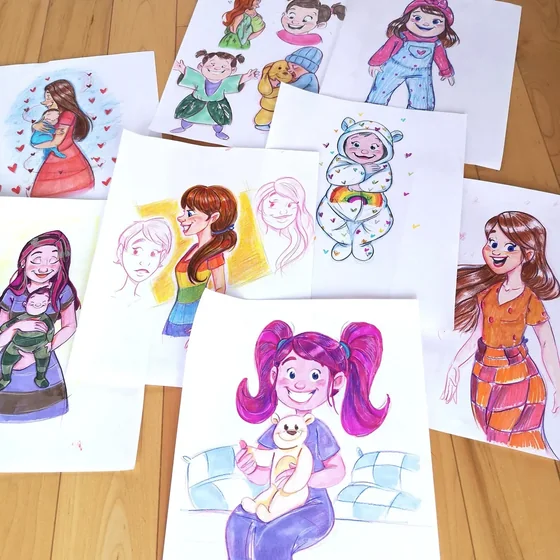 Dessins de personnages en couleur étalés sur une table de bois