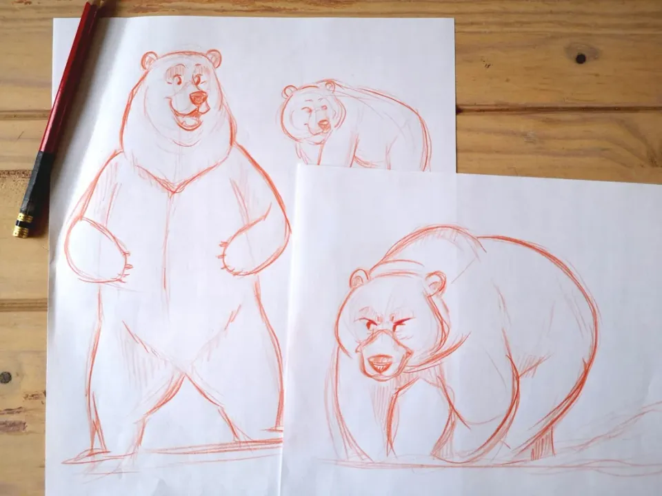 Deux croquis d’ours au crayon rouge, debout et à quatre pattes